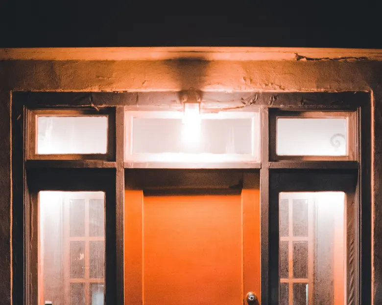 A front door at night, lit by a single porch light